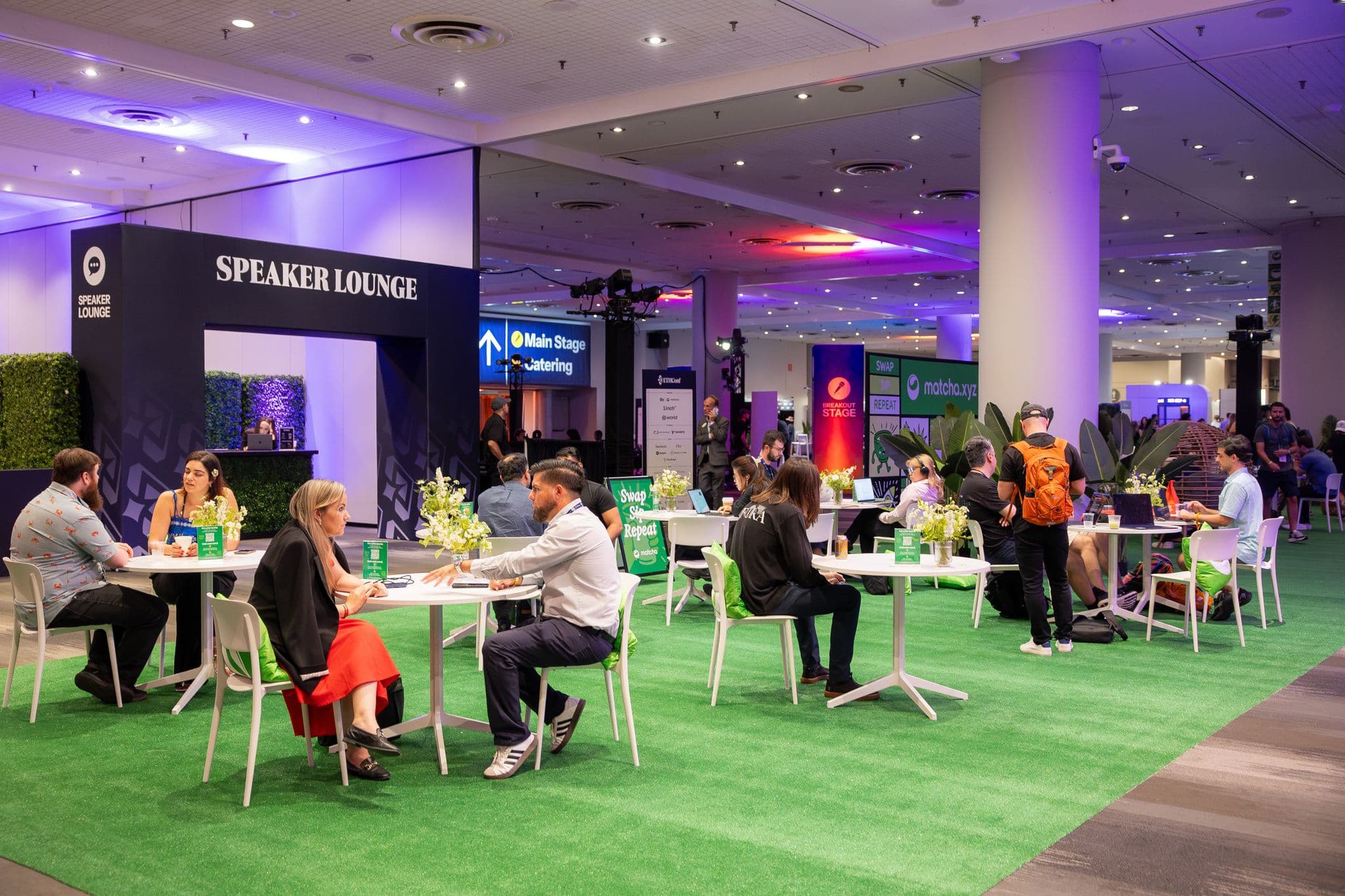 The ETHConf expo floor with stages, lounges, and partner spaces